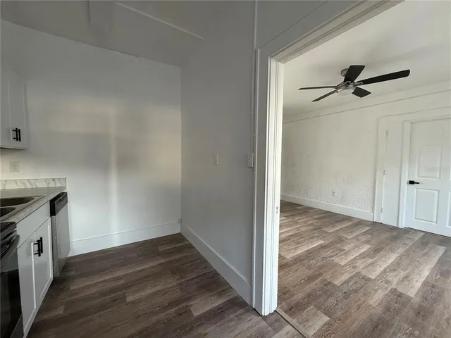 a view of a kitchen with wooden floor