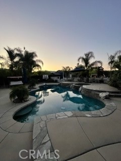 42249 CLAIRISSA Way Murrieta, CA 92562 - Photo 16 of 47 a view of swimming pool outdoor seating and living room