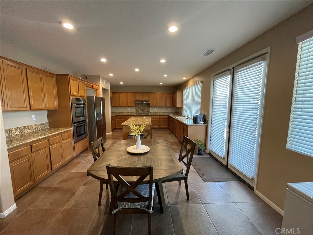 42249 CLAIRISSA Way Murrieta, CA 92562 - Photo 2 of 47 a view of a dining room with furniture window and wooden floor