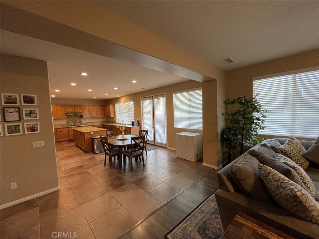 42249 CLAIRISSA Way Murrieta, CA 92562 - Photo 30 of 47 a living room with furniture and a dining table with kitchen view