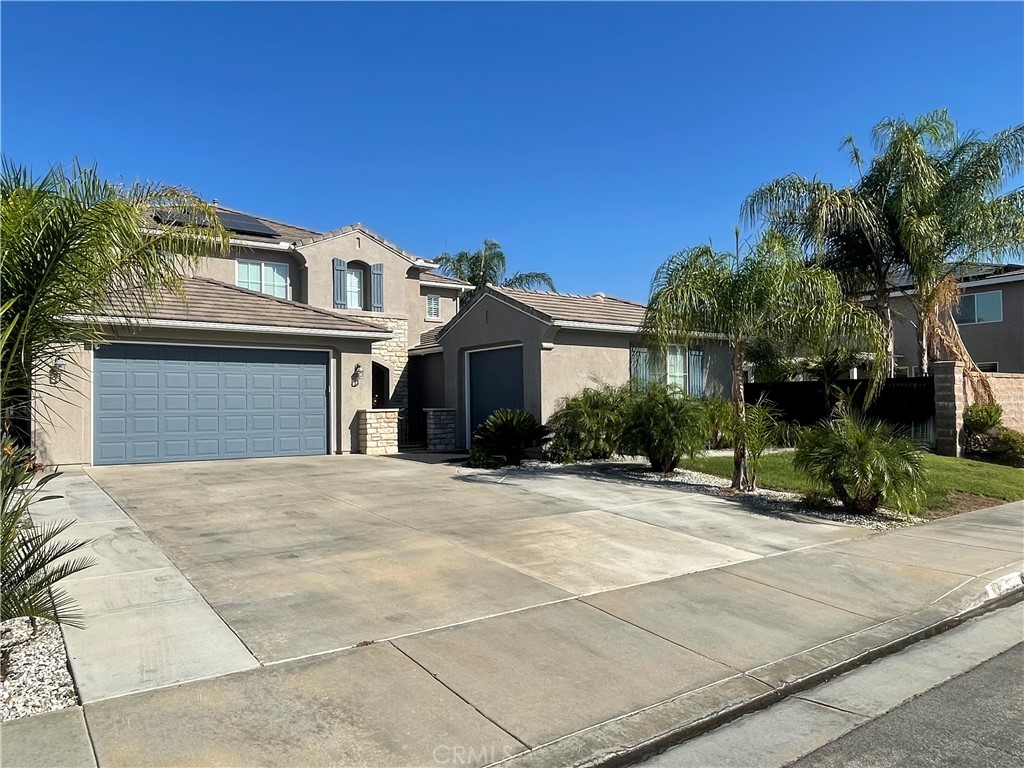 42249 CLAIRISSA Way Murrieta, CA 92562 - Photo 3 of 47 a front view of a house with a yard and garage