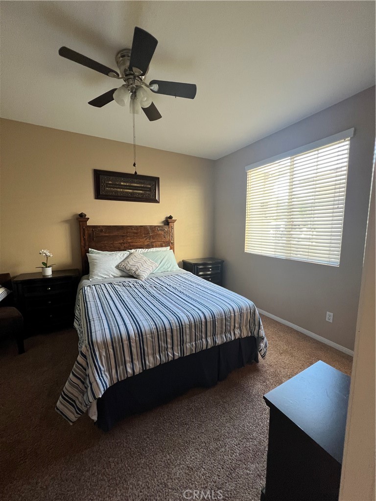 42249 CLAIRISSA Way Murrieta, CA 92562 - Photo 35 of 47 a bedroom with a bed and a night stand