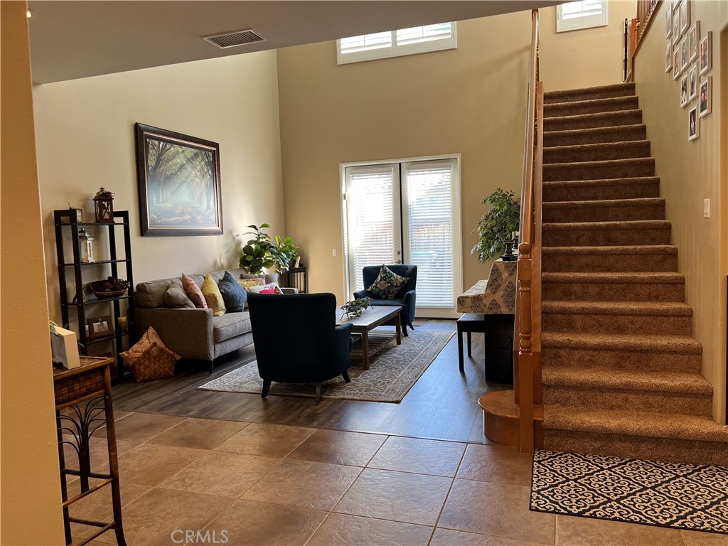 42249 CLAIRISSA Way Murrieta, CA 92562 - Photo 40 of 47 a living room with furniture and a potted plant