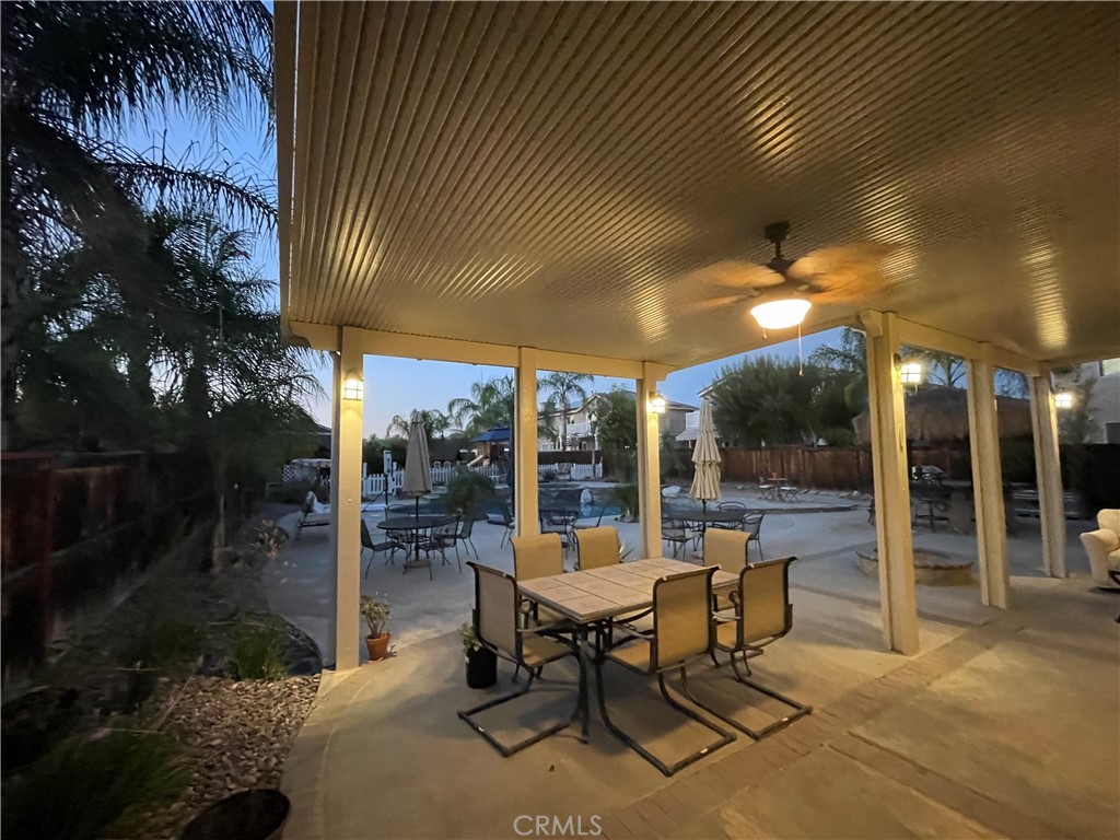 42249 CLAIRISSA Way Murrieta, CA 92562 - Photo 8 of 47 a view of a patio with a dining table and chairs