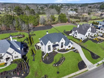 an aerial view of a house with outdoor space