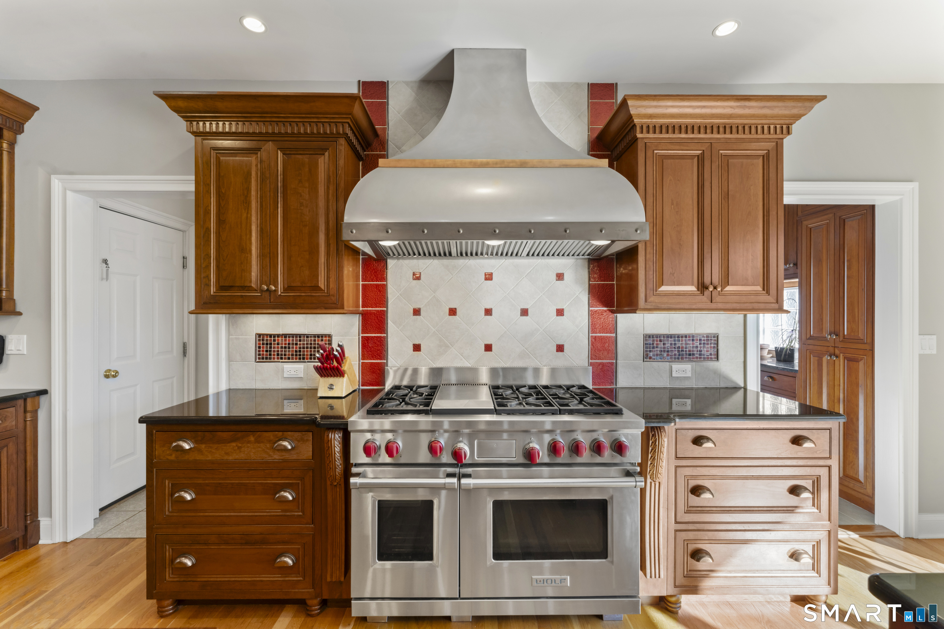8 Cornerstone Court Ridgefield, CT 06877 - Photo 11 of 40 a stove top oven sitting inside of a kitchen