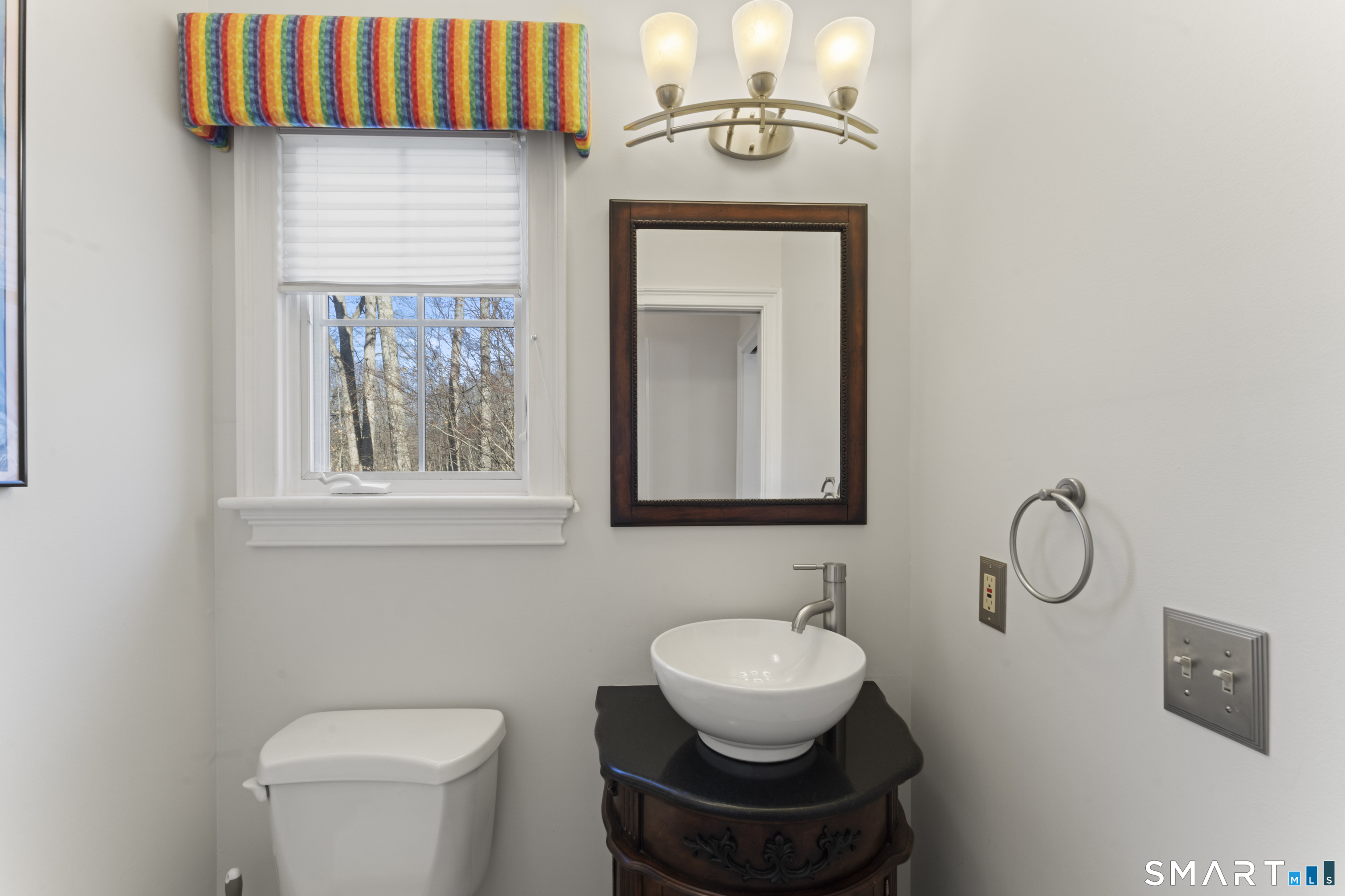 8 Cornerstone Court Ridgefield, CT 06877 - Photo 14 of 40 a bathroom with a toilet a sink and mirror