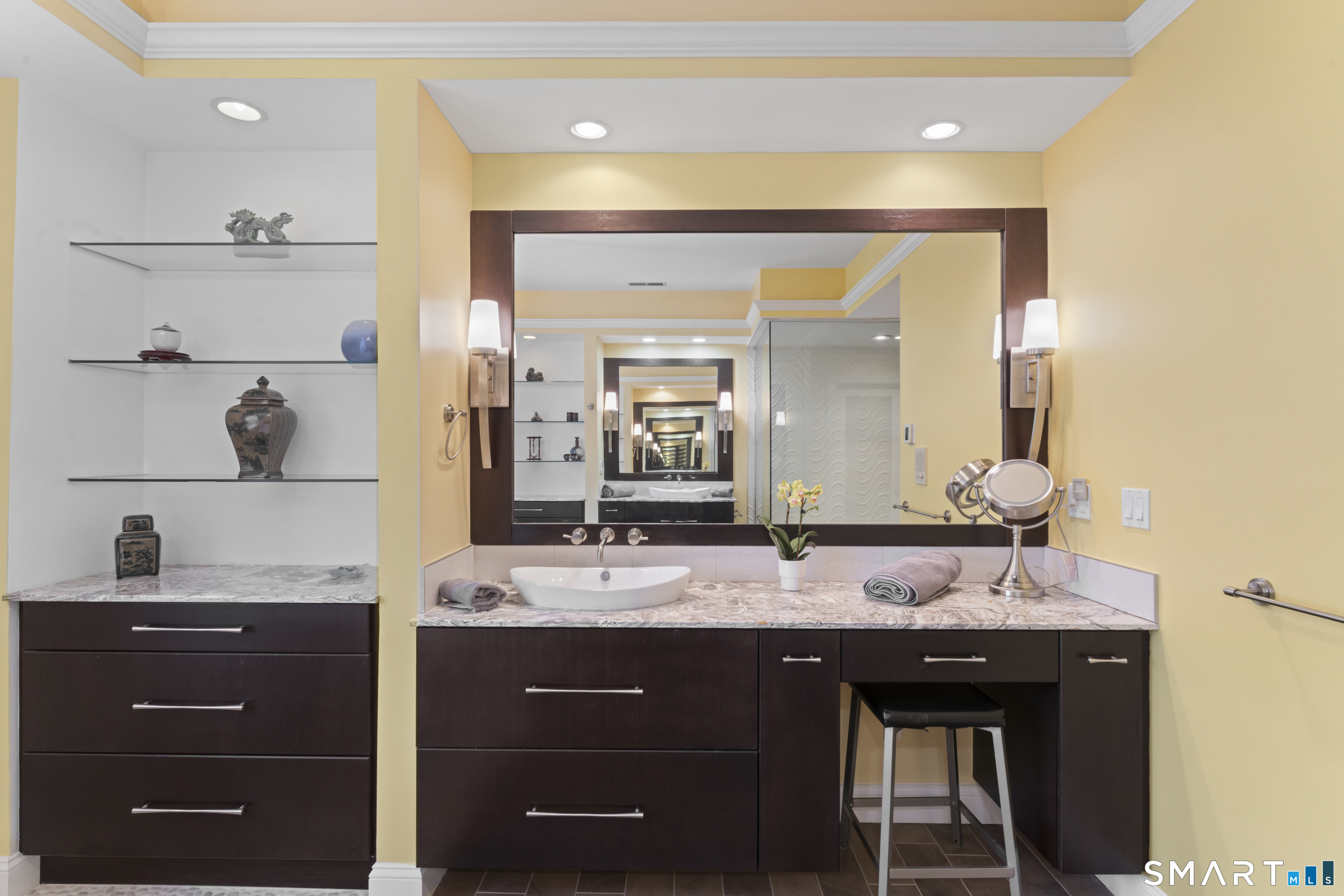 8 Cornerstone Court Ridgefield, CT 06877 - Photo 19 of 40 a bathroom with a granite countertop sink and a mirror