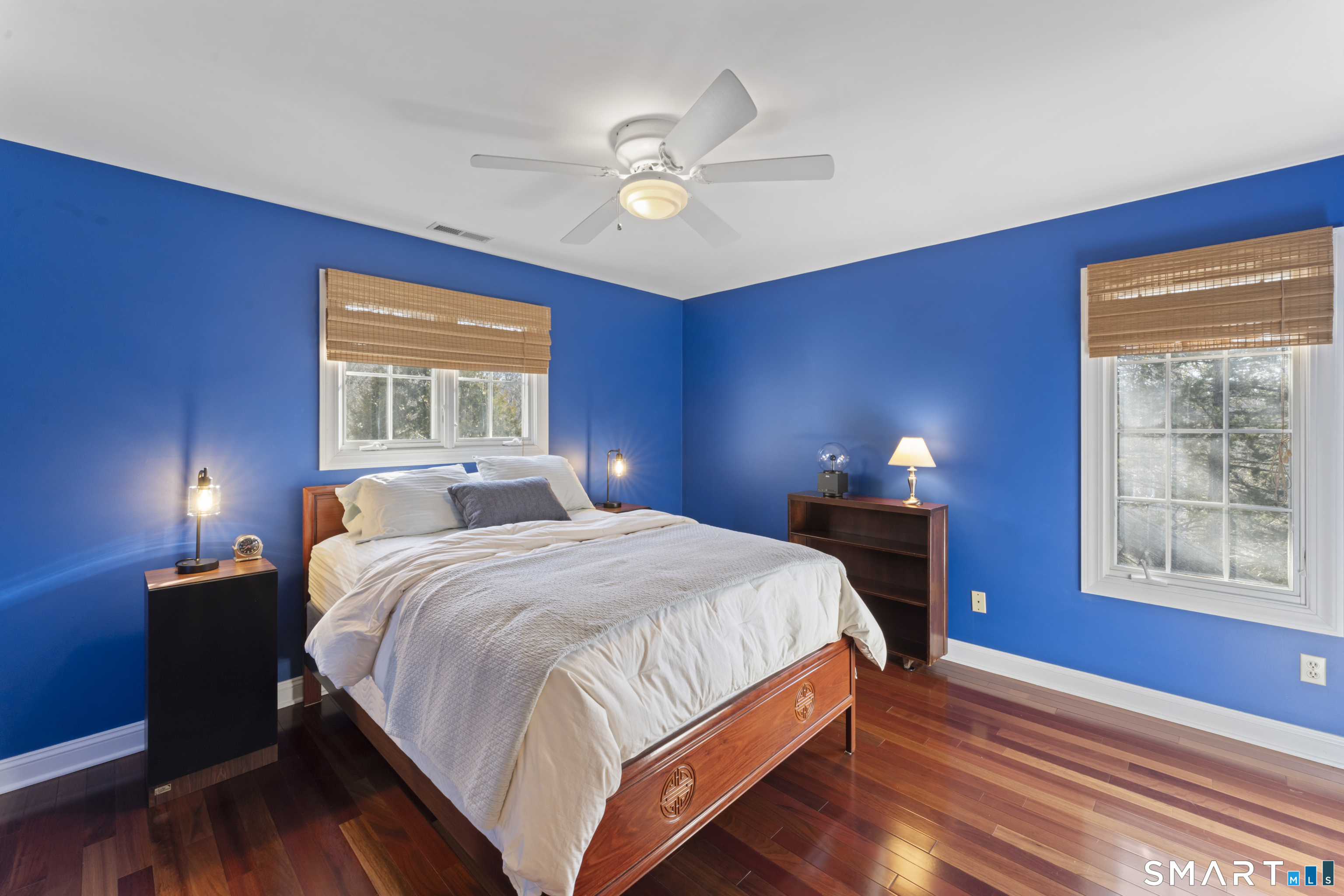 8 Cornerstone Court Ridgefield, CT 06877 - Photo 23 of 40 a bedroom with a bed a chandelier and a window