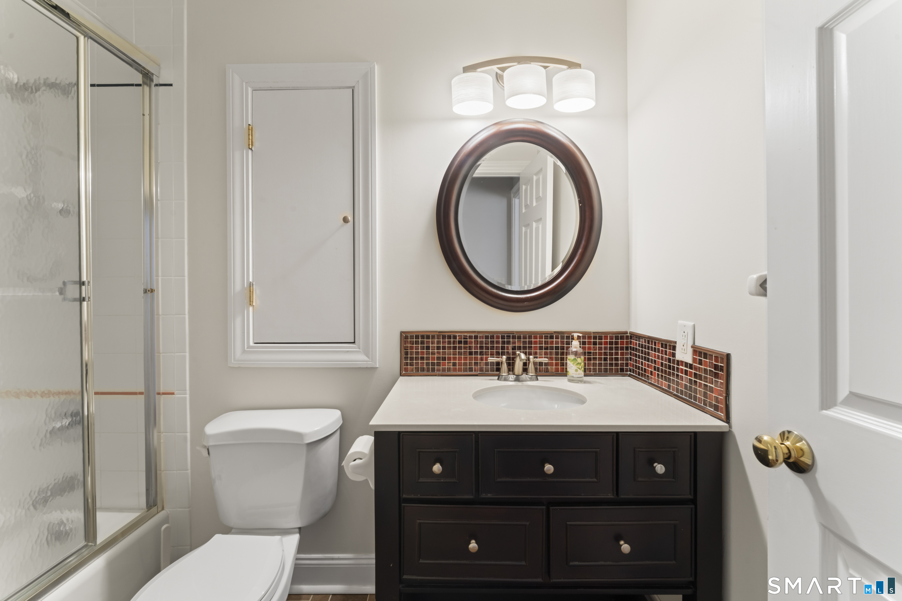 8 Cornerstone Court Ridgefield, CT 06877 - Photo 25 of 40 a bathroom with a sink a toilet and a mirror