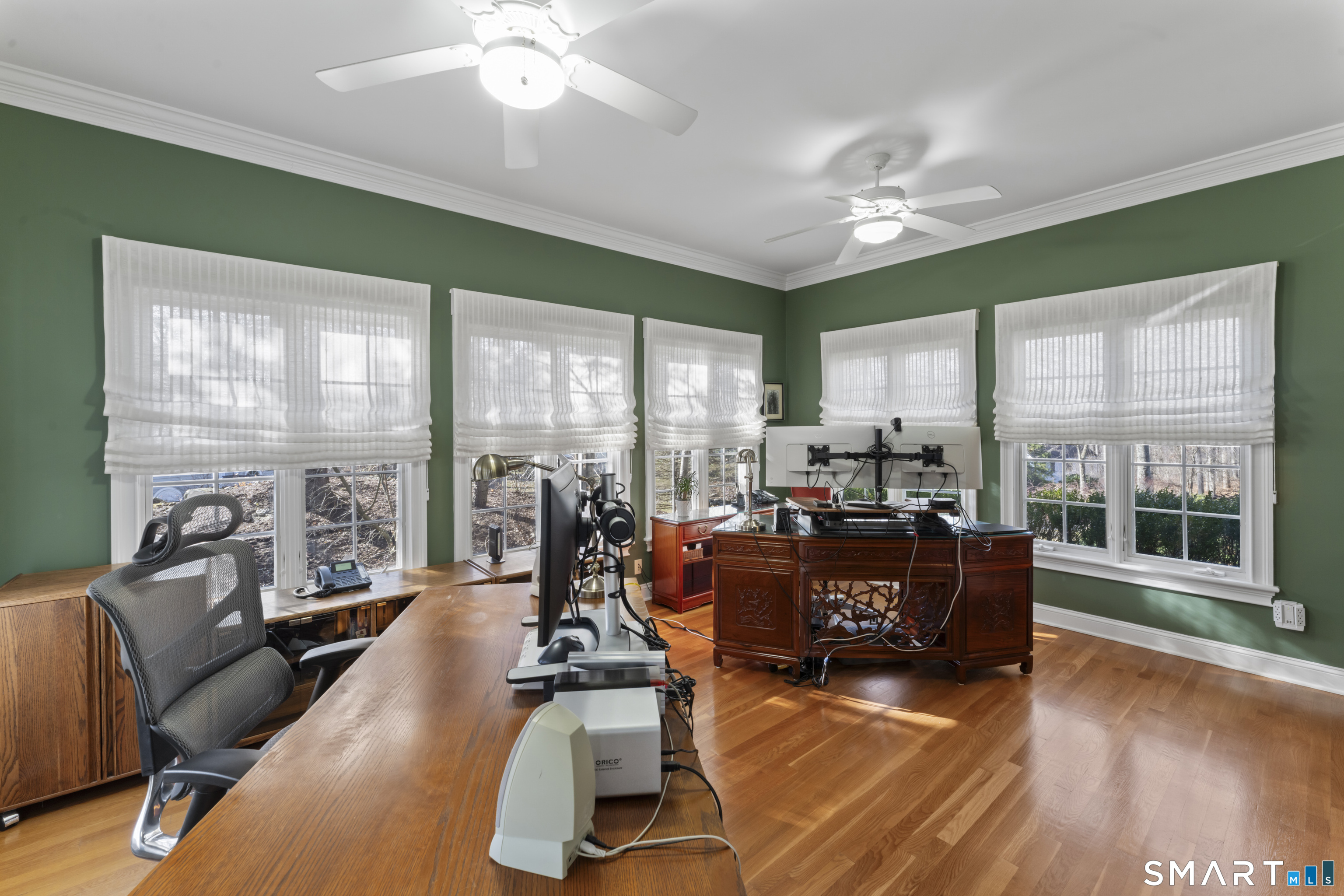 8 Cornerstone Court Ridgefield, CT 06877 - Photo 28 of 40 a living room with furniture large windows and wooden floor
