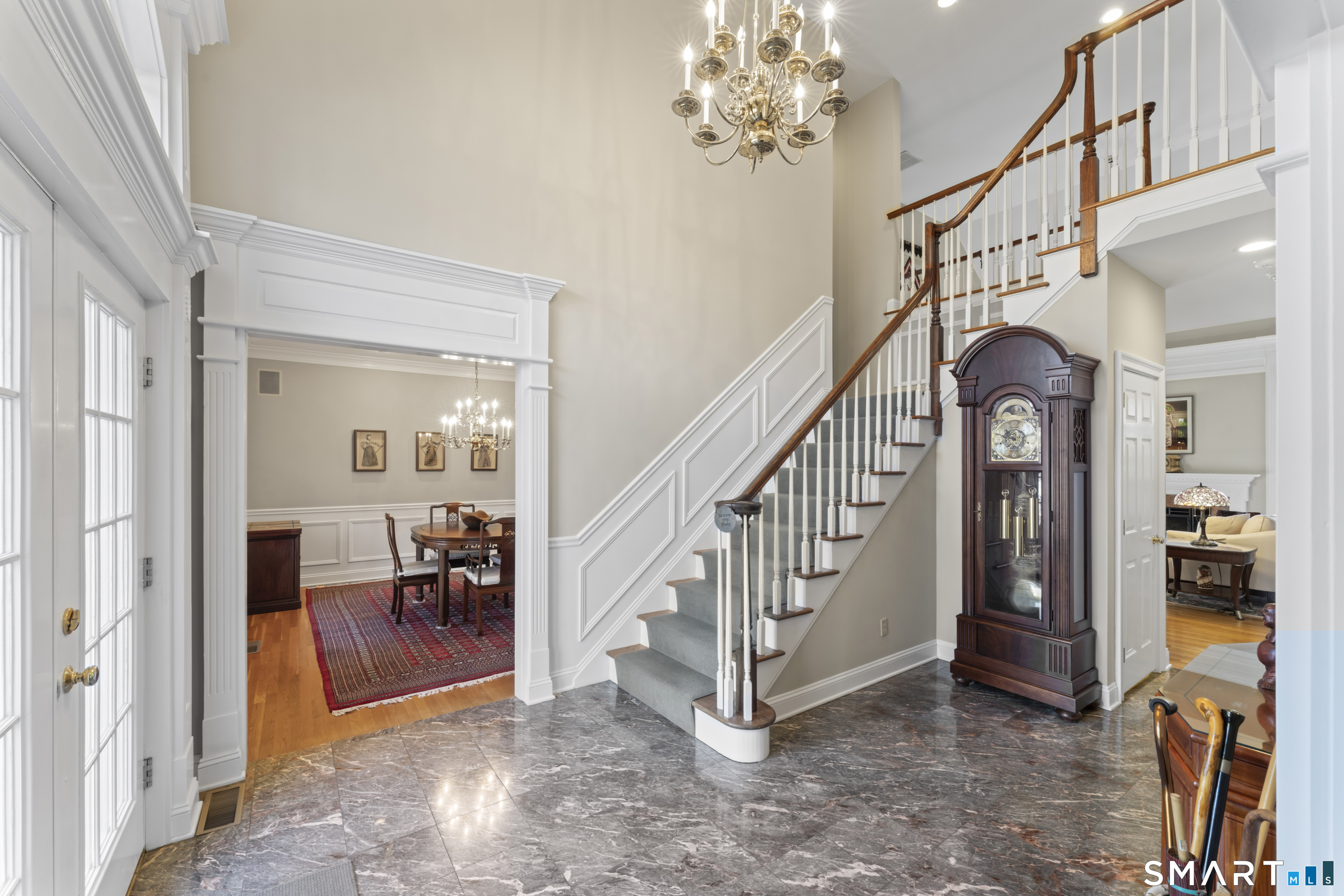 8 Cornerstone Court Ridgefield, CT 06877 - Photo 3 of 40 a view of staircase with a mirror and a bath tub