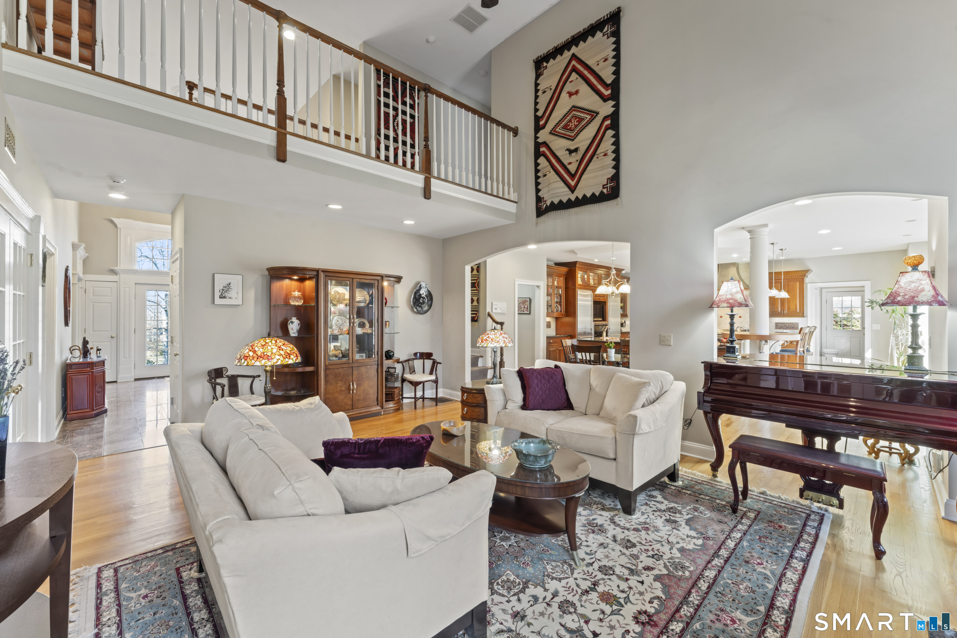 8 Cornerstone Court Ridgefield, CT 06877 - Photo 32 of 40 a living room with furniture and a rug