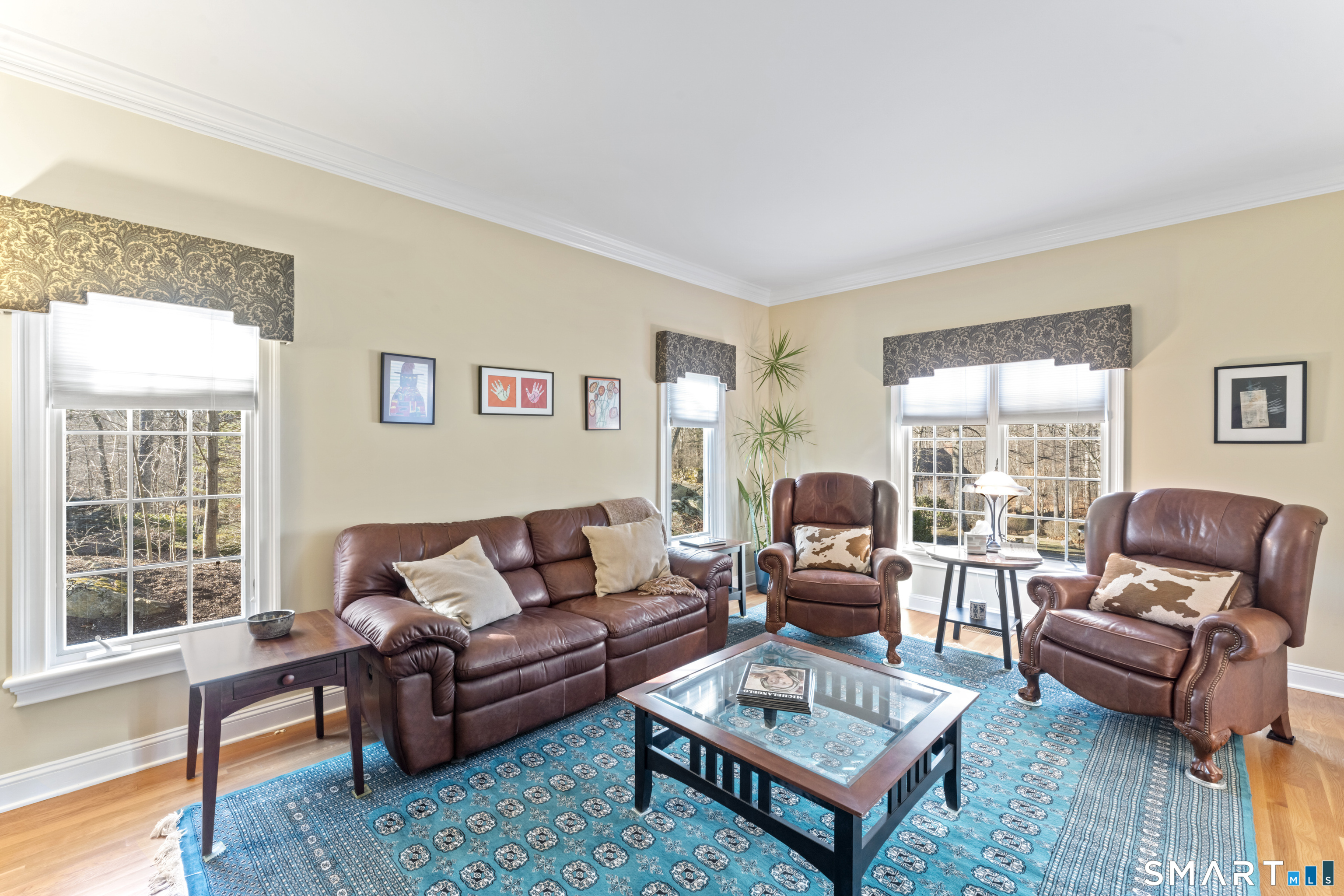 8 Cornerstone Court Ridgefield, CT 06877 - Photo 5 of 40 a living room with furniture a rug and a large window