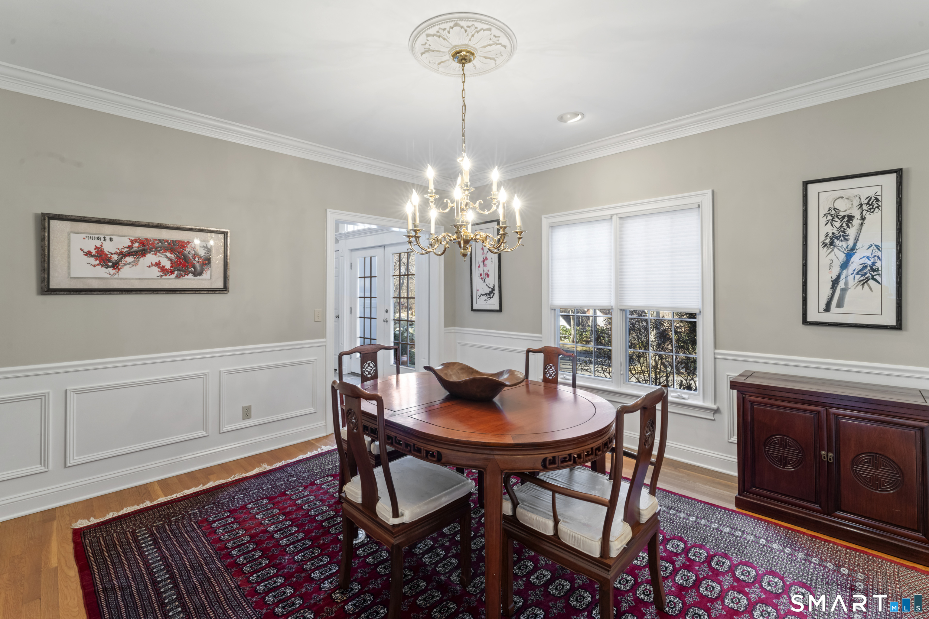 8 Cornerstone Court Ridgefield, CT 06877 - Photo 7 of 40 a view of a dining room with furniture and chandelier