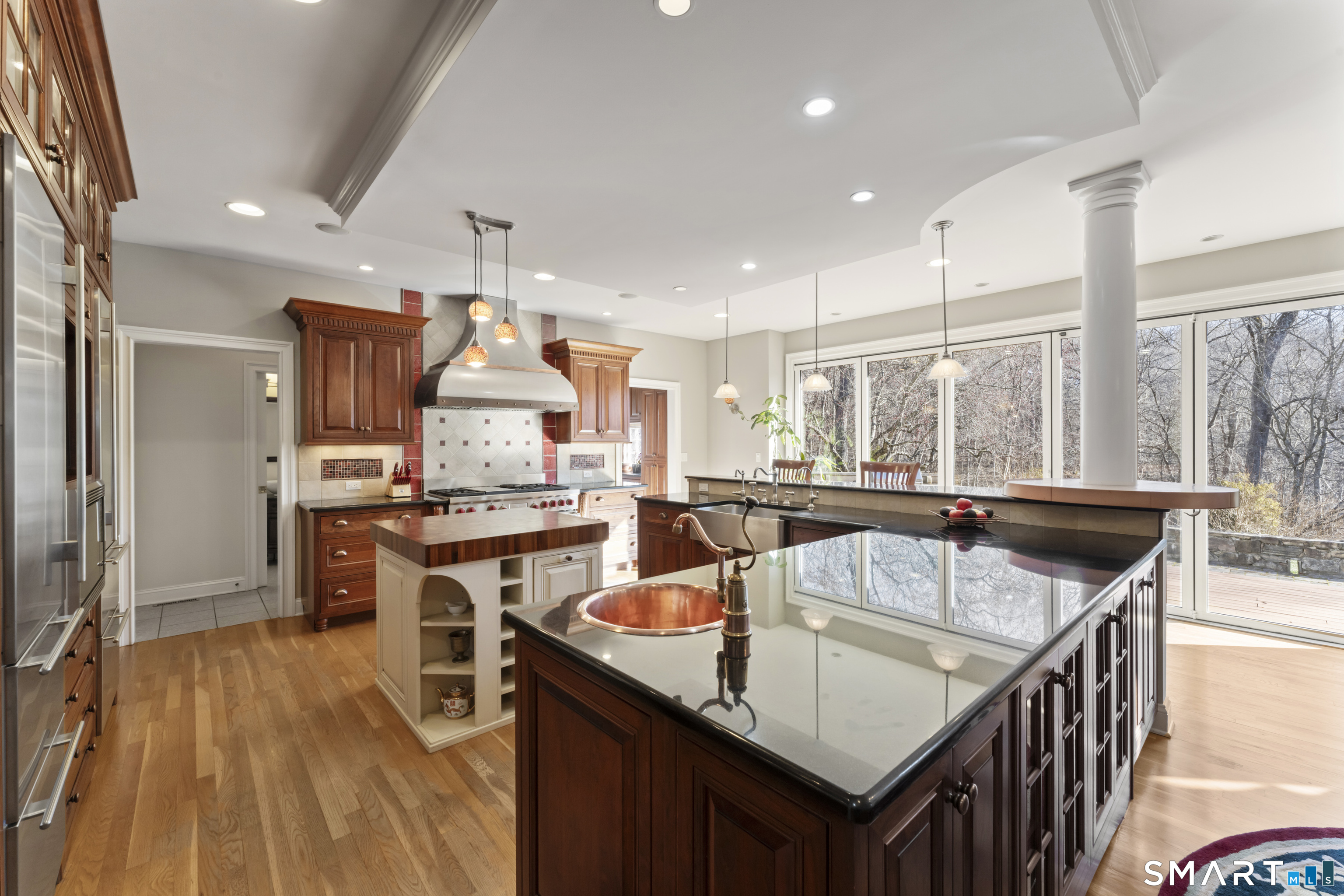 8 Cornerstone Court Ridgefield, CT 06877 - Photo 9 of 40 a kitchen with stainless steel appliances granite countertop sink stove and refrigerator