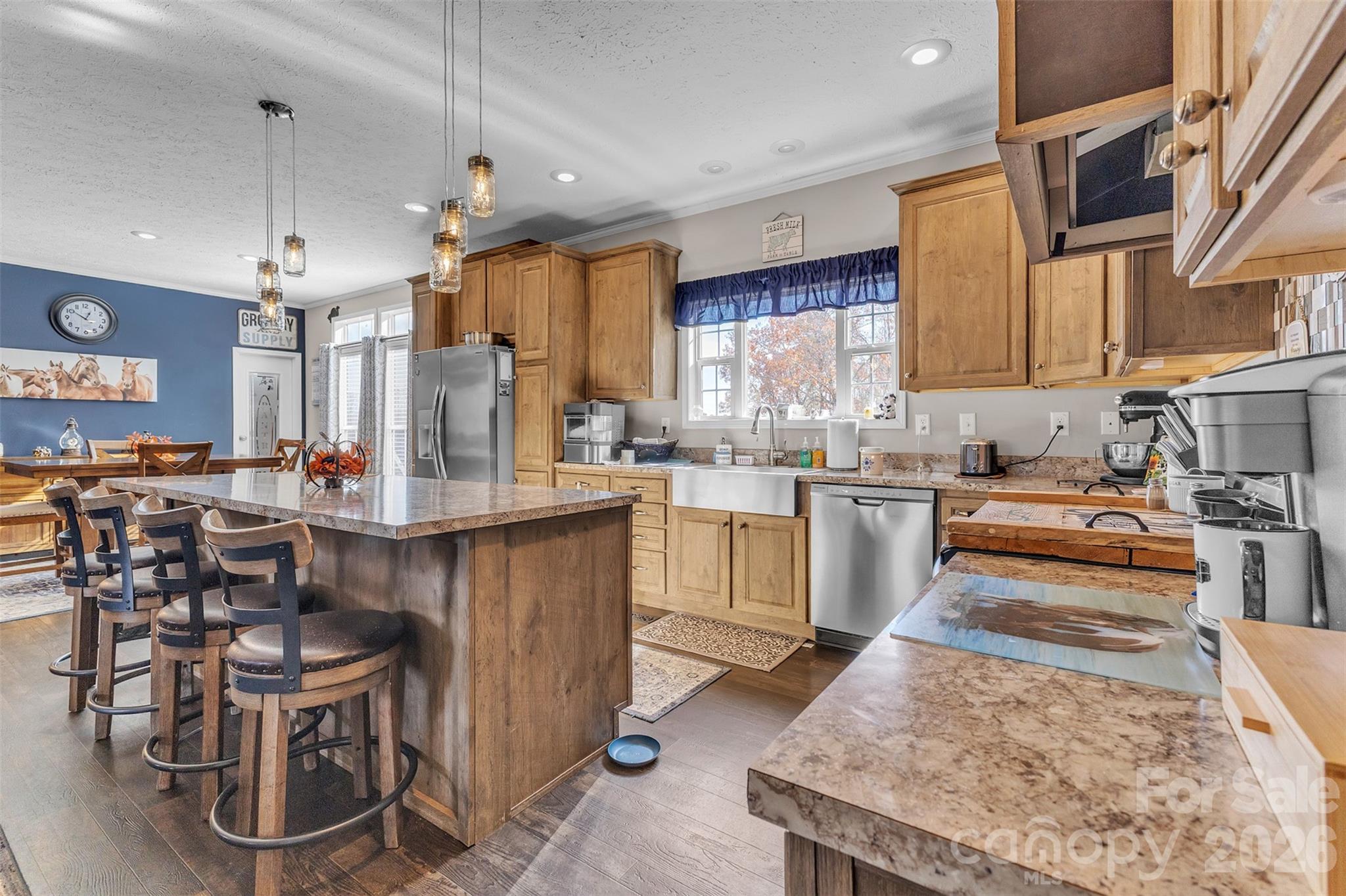 72 Crouch Road Taylorsville, NC 28681 - Photo 13 of 48 a kitchen with stainless steel appliances granite countertop table chairs sink and cabinets