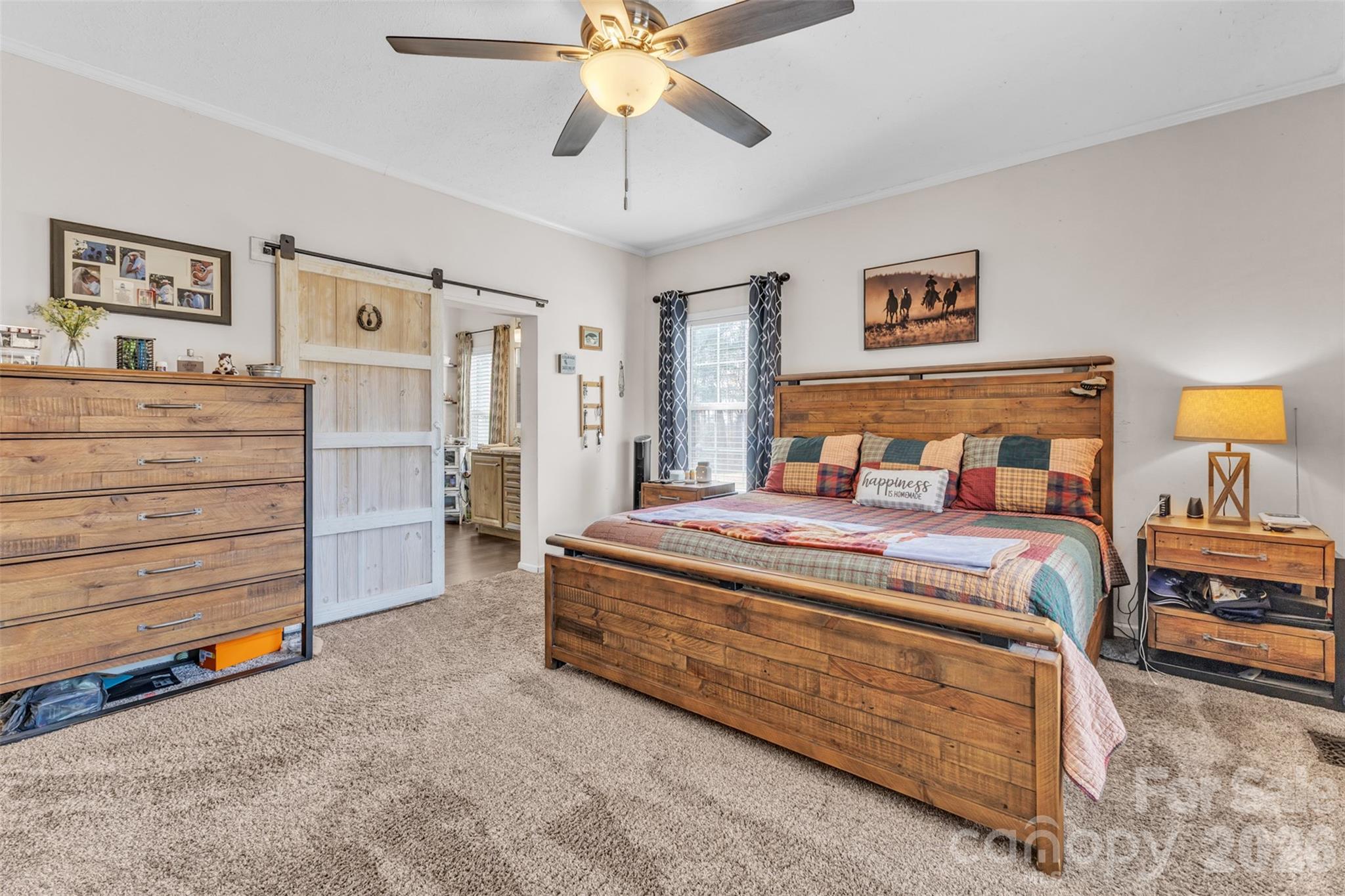 72 Crouch Road Taylorsville, NC 28681 - Photo 16 of 48 a bedroom with a bed and a chandelier