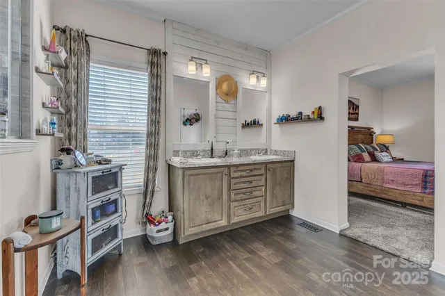 a bathroom with a double vanity sink and a mirror