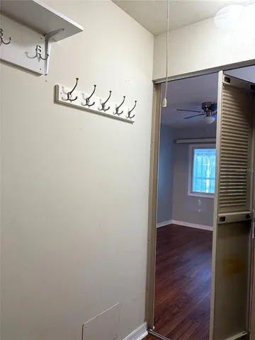 a view of front door with wooden floor