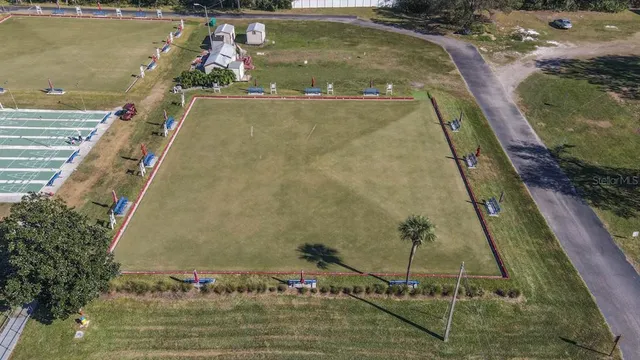 an aerial view of a house with a yard and garden