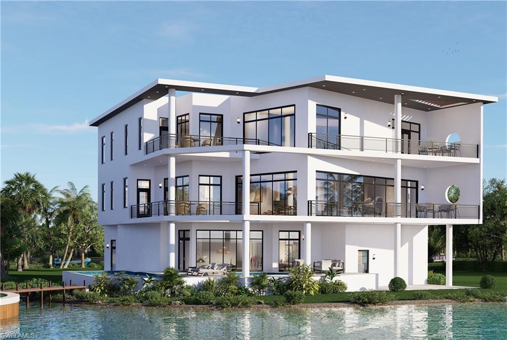 27211 Del Lane Bonita Springs, FL 34135 - Photo 2 of 6 a front view of a house with a lake view