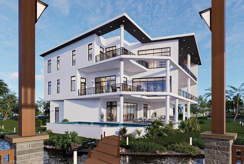 27211 Del Lane Bonita Springs, FL 34135 - Photo 5 of 6 a front view of a residential apartment building with a yard