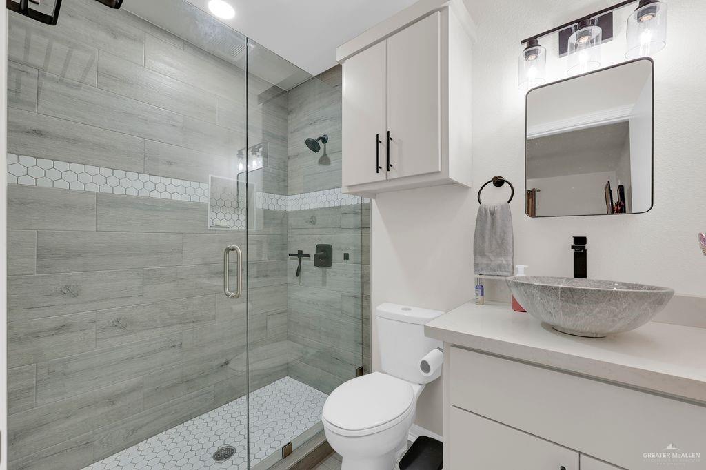 400 Taurus Street Mission, TX 78572 - Photo 12 of 16 Full bath featuring vanity and a stall shower