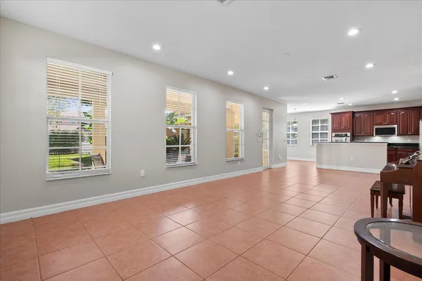 a kitchen with stainless steel appliances granite countertop wooden cabinets a stove top oven a sink and dishwasher
