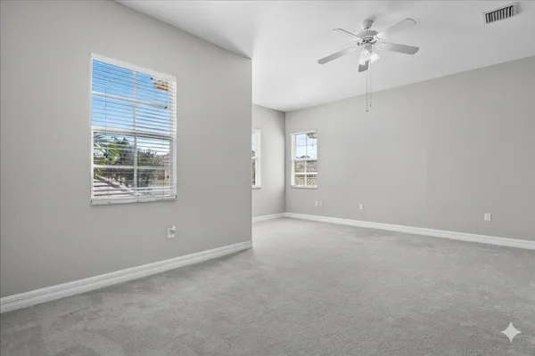 a kitchen with stainless steel appliances granite countertop a sink a stove and a microwave