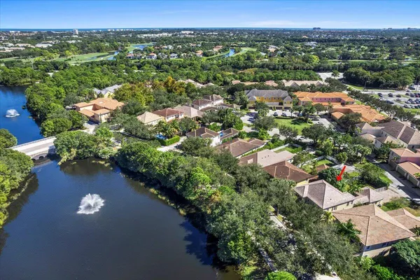 an aerial view of residential houses with outdoor space and street view