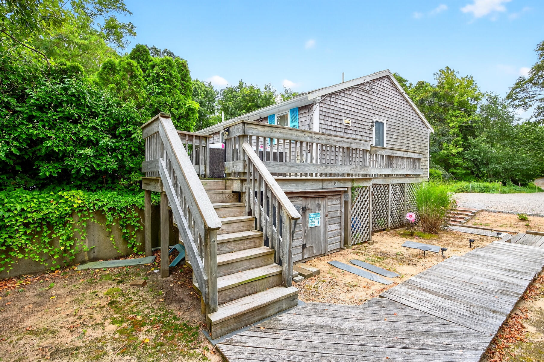 4 Coffey Lane Dennis Port, MA 02639 - Photo 37 of 48 a view of a house with wooden floor next to a yard