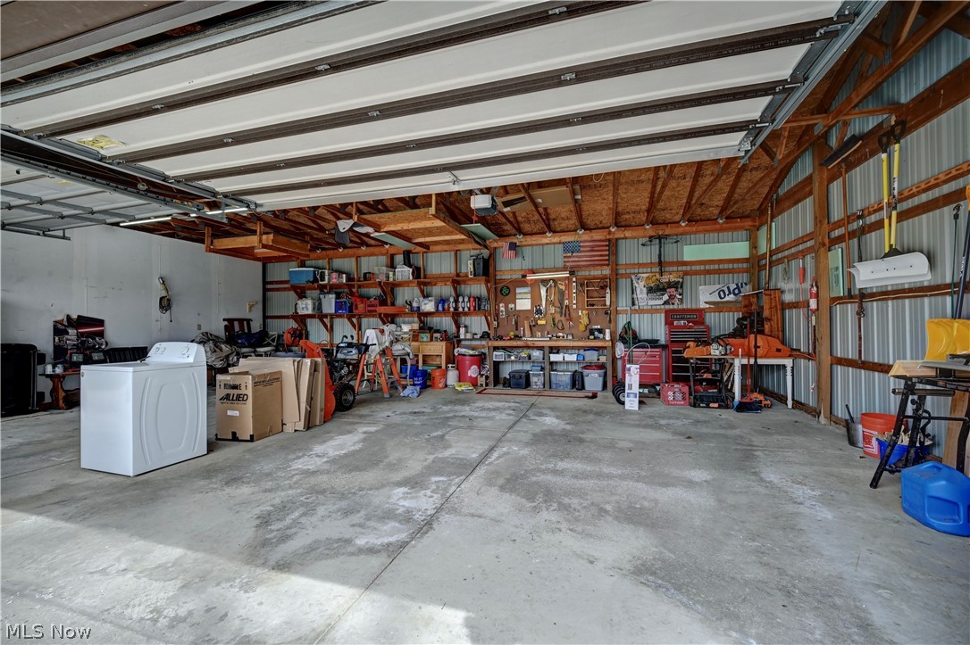 8045 McFadden Road Shreve, OH 44676 - Photo 42 of 45 Garage featuring a workshop area and washer / clothes dryer