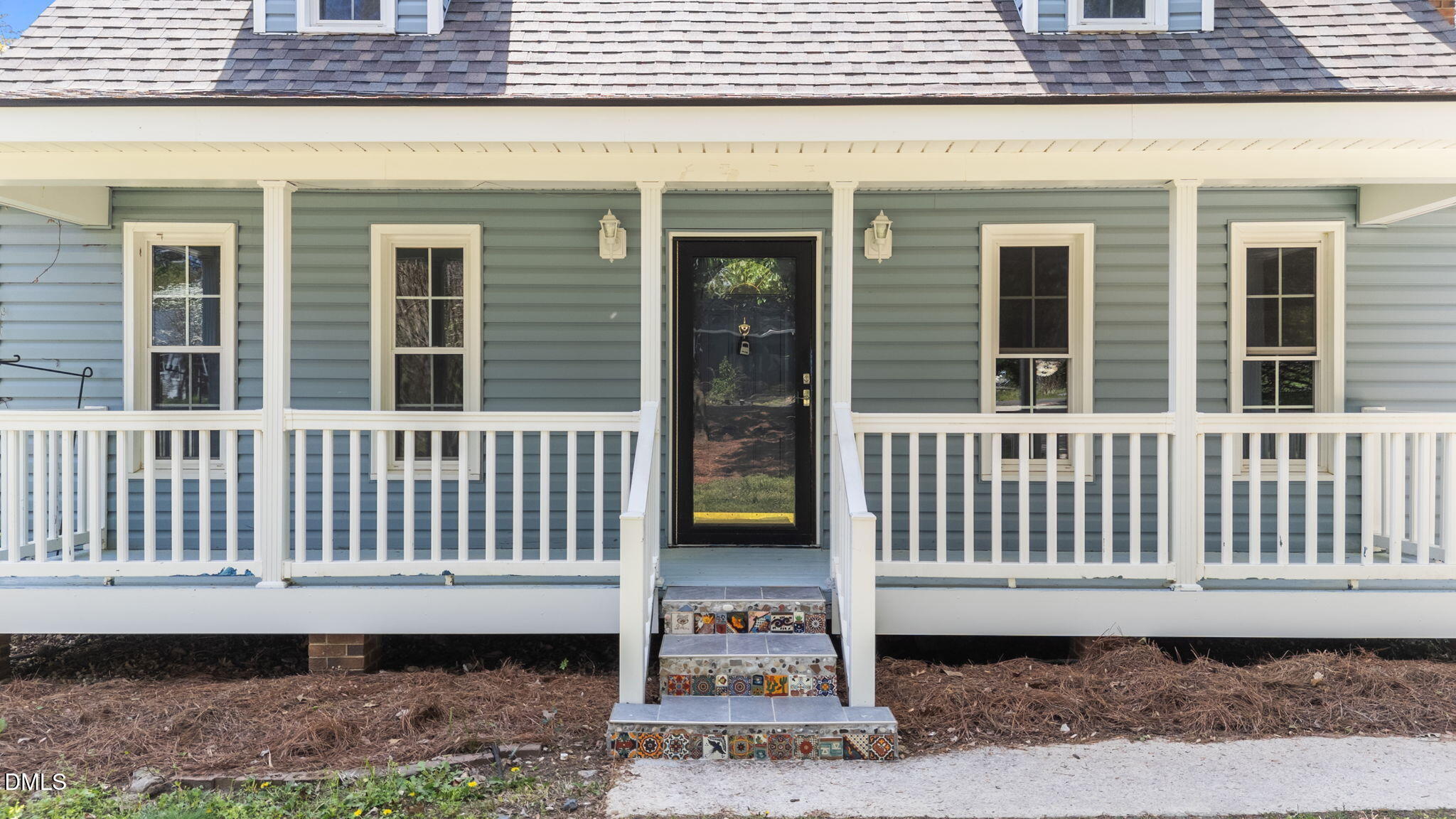 804 Olive Street Apex, NC 27502 - Photo 4 of 60 a view of a brick house with a large window
