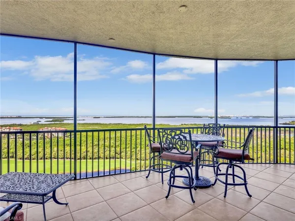 a view of a balcony with furniture