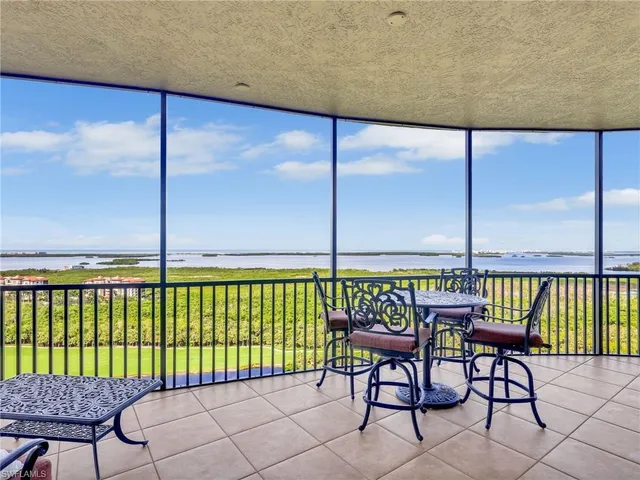 a view of a balcony with furniture