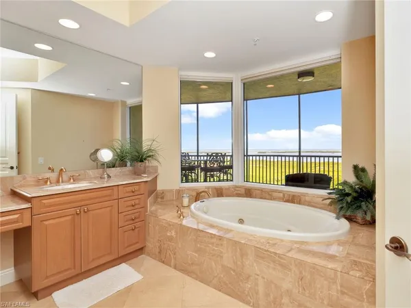 a bathroom with a bathtub and a sink