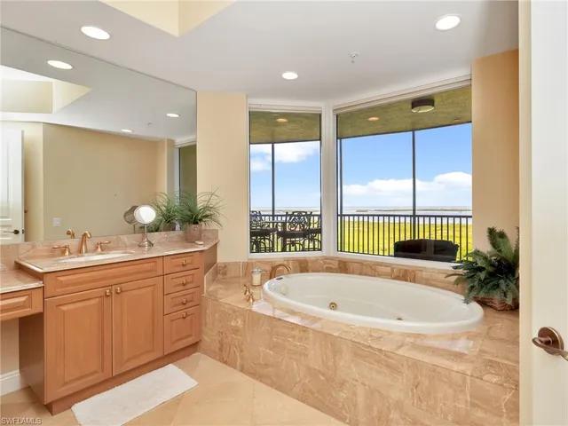 a bathroom with a bathtub and a sink