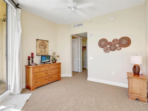 a room with furniture and mirror