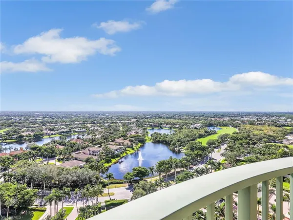 an aerial view of city and lake