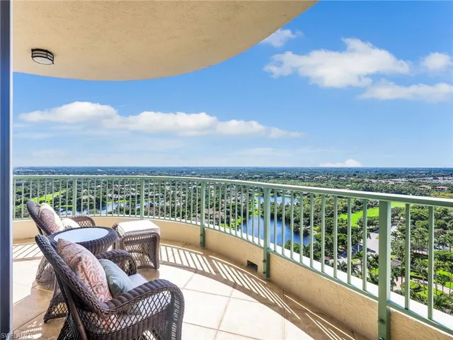 a view of a balcony with furniture