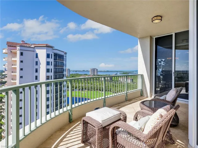 a view of a chairs and table in patio