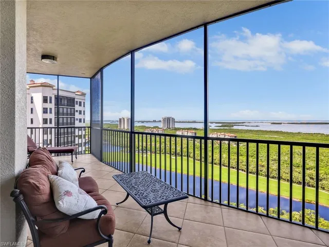 a balcony with view of city and mountain view
