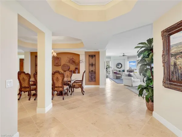 a view of a livingroom with furniture and a potted plant