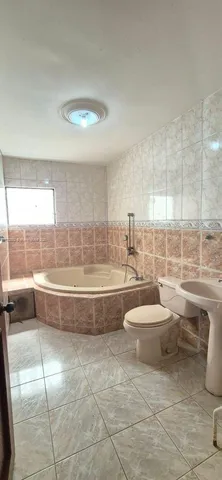a bathroom with a toilet a sink and bathtub