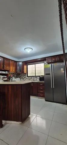 a kitchen with stainless steel appliances granite countertop a refrigerator and a counter