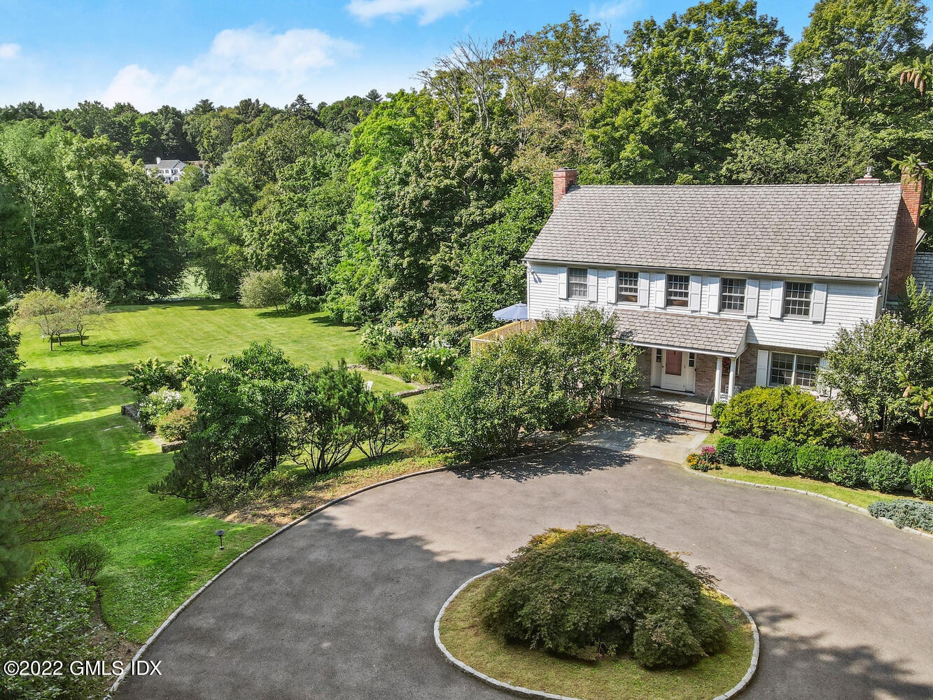 121 Clapboard Ridge Road Greenwich, CT 06830 - Photo 1 of 23 a view of a house with a yard