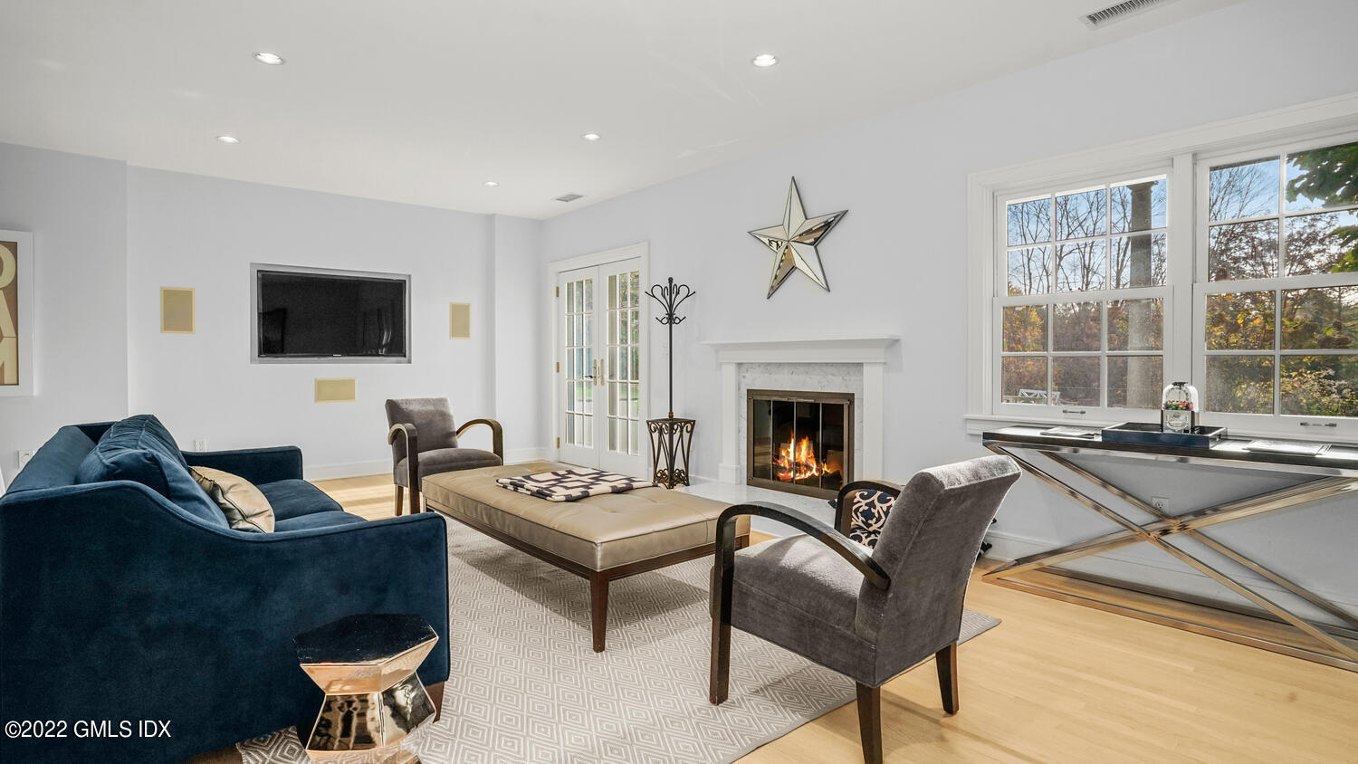 121 Clapboard Ridge Road Greenwich, CT 06830 - Photo 14 of 23 a living room with furniture a flat screen tv and a fireplace