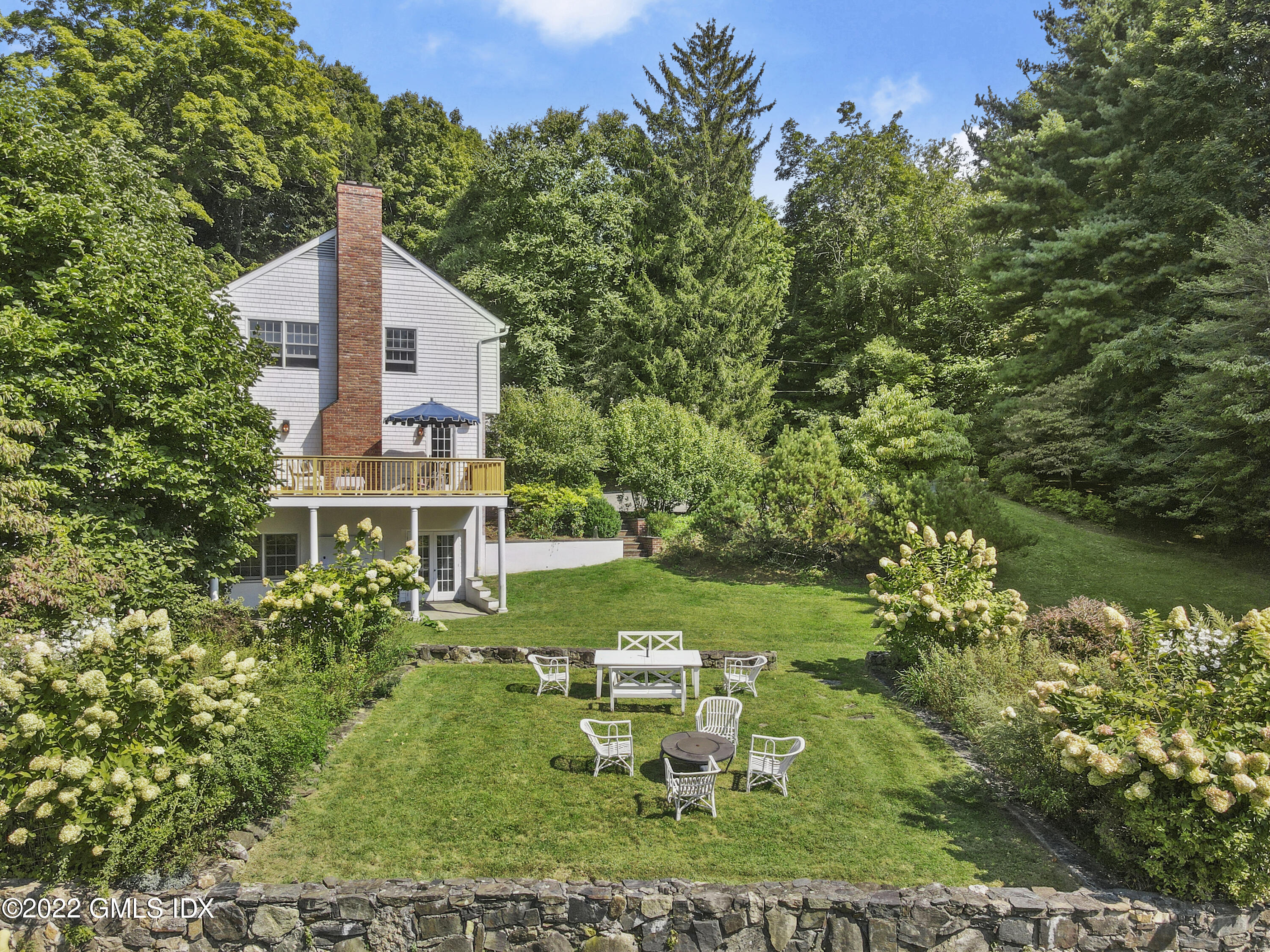 121 Clapboard Ridge Road Greenwich, CT 06830 - Photo 19 of 23 a view of a house with a yard
