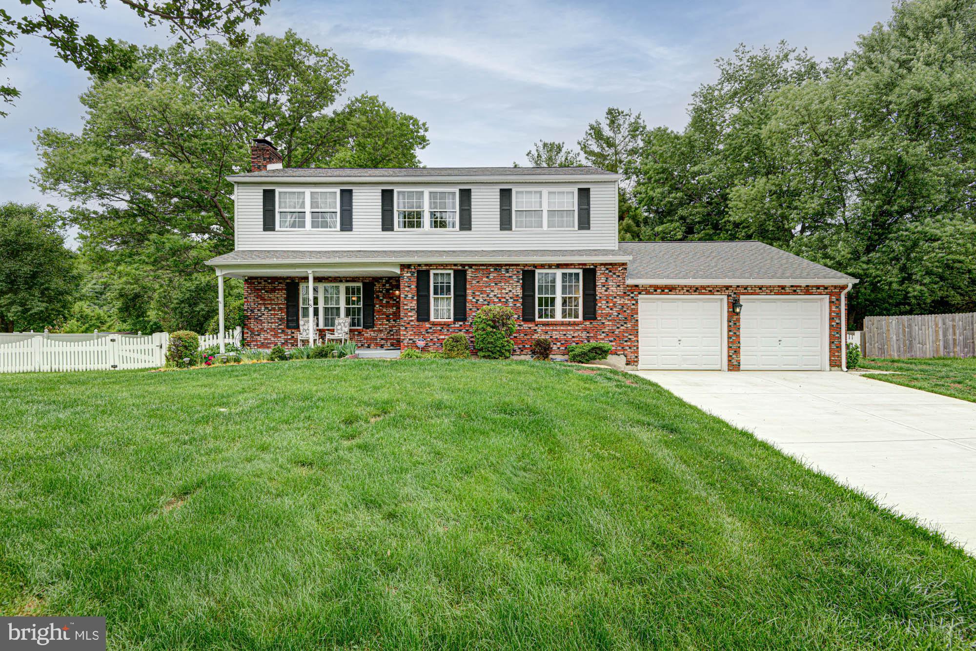 8 Risa Court Newark, DE 19702 - Photo 4 of 58 a front view of a house with garden and trees